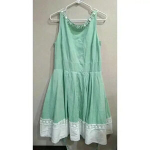 Mint green sleeveless party dress w/white jeweled collar & white lace hem line